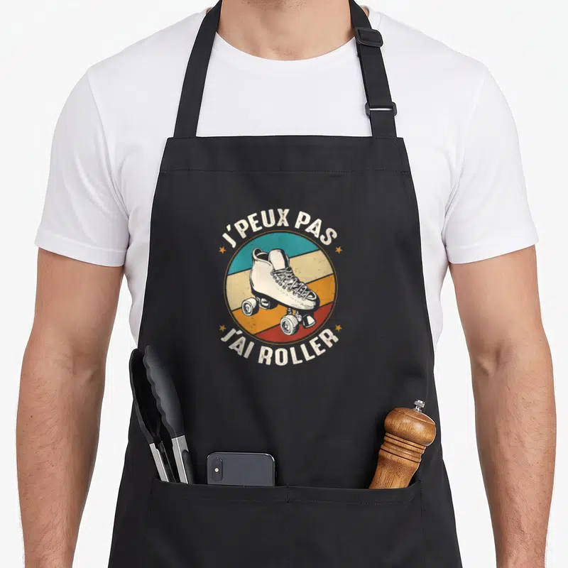 Tablier de cuisine noir avec illustration patin à roulettes retro et texte j'peux pas j'ai roller.