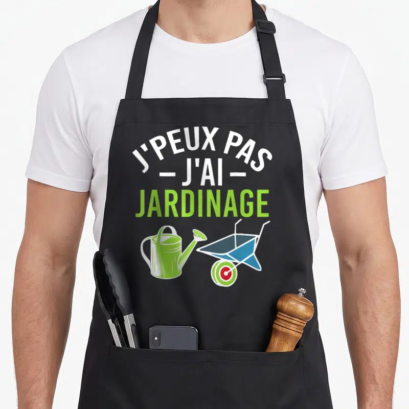 Tablier de cuisine noir avec texte blanc vert et illustrations d'arrosoir et brouette colorées