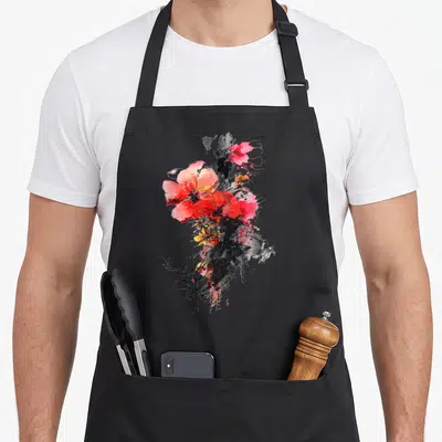 Tablier de cuisine noir avec une fleur abstraite rose et rouge sur fond noir graphiste.