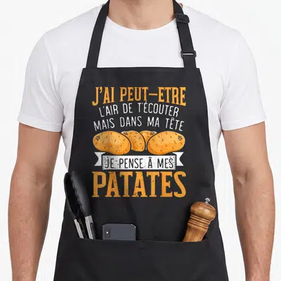 Tablier de cuisine noir avec inscription orange et blanche sur le thème des patates et du jardinage.