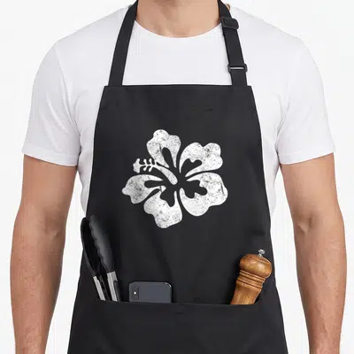Tablier de cuisine noir avec une grande fleur d'hibiscus blanche au centre, style texture granuleuse.