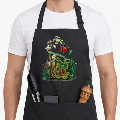 Tablier de cuisine noir avec illustration botanique vintage de Sarracenia plante carnivore verte et rouge.