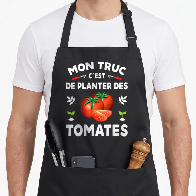 Tablier de cuisine noir avec inscription Mon truc c'est de planter des tomates et illustration de tomates rouges