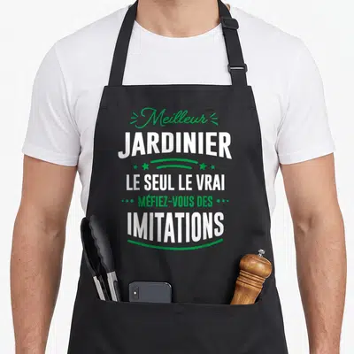 Tablier de cuisine noir avec inscription Meilleur Jardinier Le Seul Le Vrai Méfiez-vous des Imitations en typographie blanche et verte.