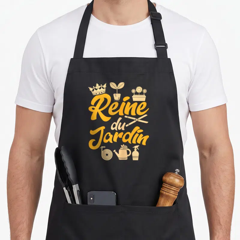 Tablier de cuisine noir avec typographie Reine du Jardin et icônes de jardinage dorées.