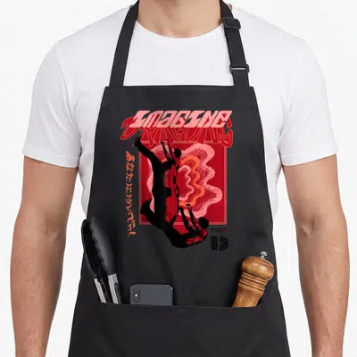 Tablier de cuisine noir avec illustration rouge Imagine Dragons et silhouettes en chute verticale.