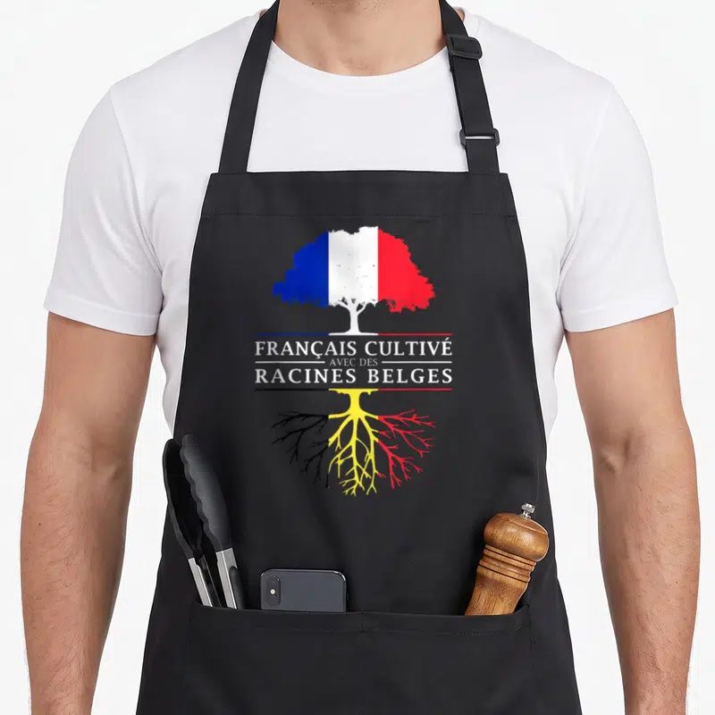Tablier de cuisine noir avec un arbre aux couleurs du drapeau français et des racines aux couleurs du drapeau belge.