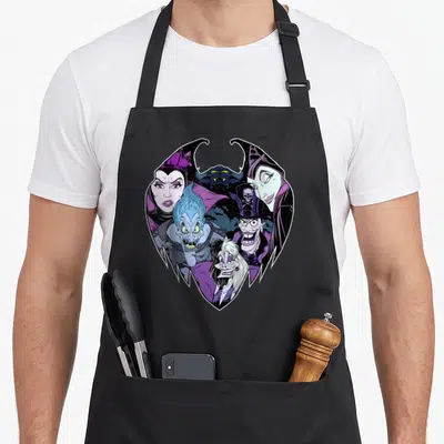 Tablier de cuisine noir avec un groupement de méchants de dessin animé aux teintes violettes et bleues.