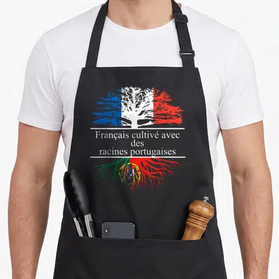 Tablier de cuisine noir avec un motif d'arbre stylisé aux couleurs du drapeau français et des racines aux teintes portugaises.