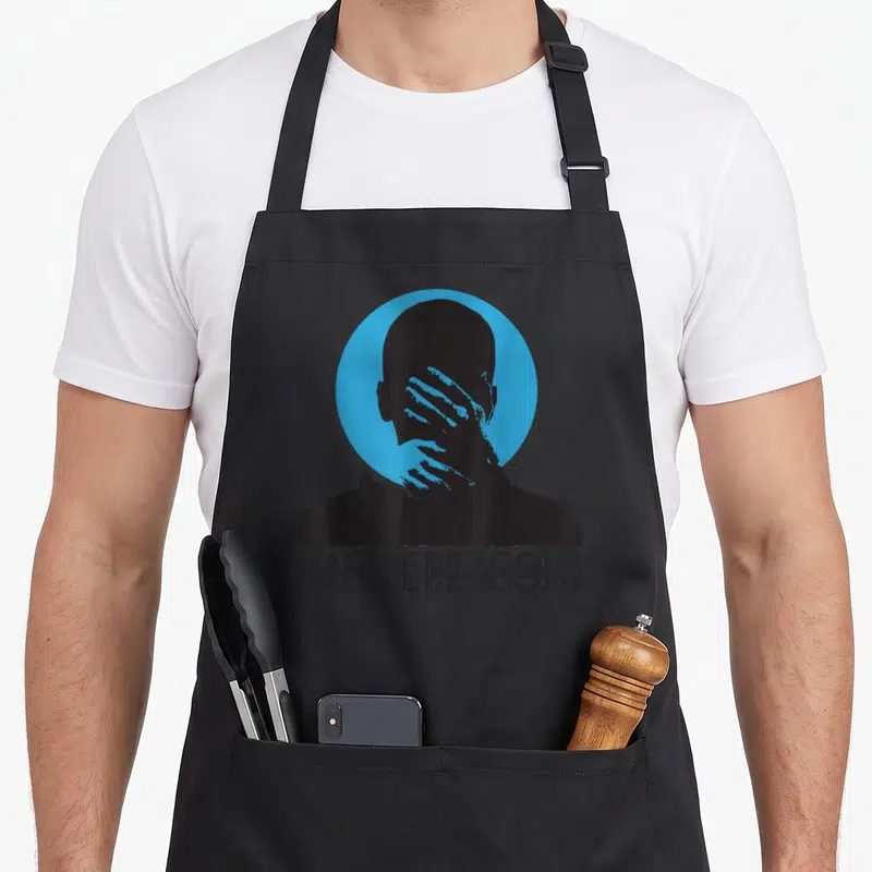 Tablier de cuisine noir avec silhouette mains visage cercle bleu texte Imagine Dragons