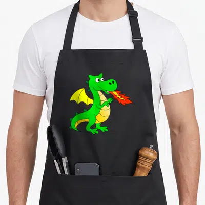 Tablier de cuisine noir avec un dragon vert crachant des flammes jaunes et rouges sur le devant.