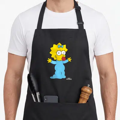 Tablier de cuisine noir avec Maggie des Simpson en pyjama bleu tendant les bras pour un câlin.