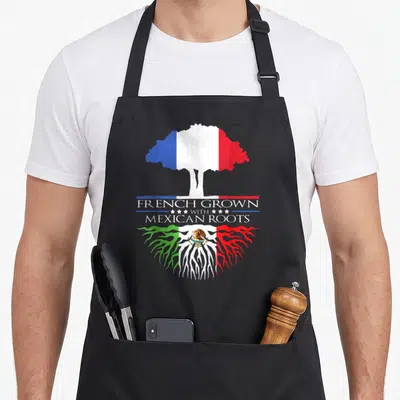 Tablier de cuisine noir avec un arbre aux couleurs du drapeau français et des racines mexicaines ornées de l'aigle.