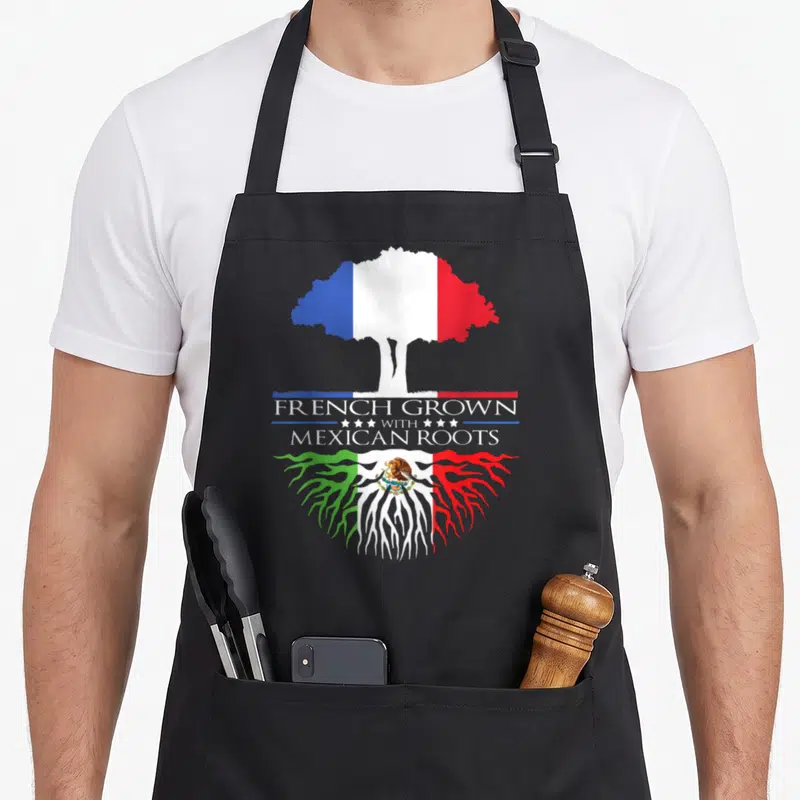 Tablier de cuisine noir avec un arbre aux couleurs du drapeau français et des racines mexicaines ornées de l'aigle.
