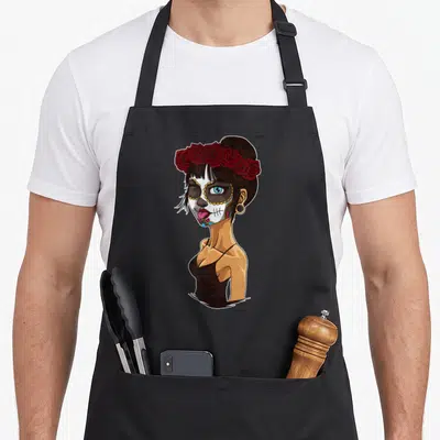 Tablier de cuisine noir avec une illustration de femme squelette coiffée de roses rouges et de maquillage de calavera.