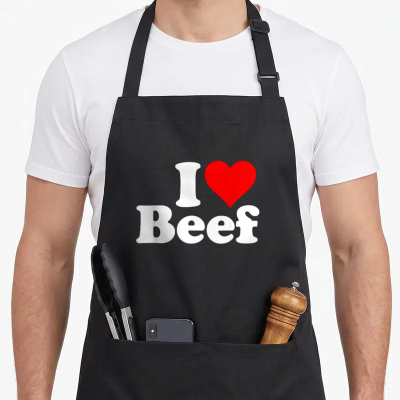 Tablier de cuisine noir avec inscription blanche et rouge J'adore le régime des carnivores de bœuf au cœur et logo I love Beef.