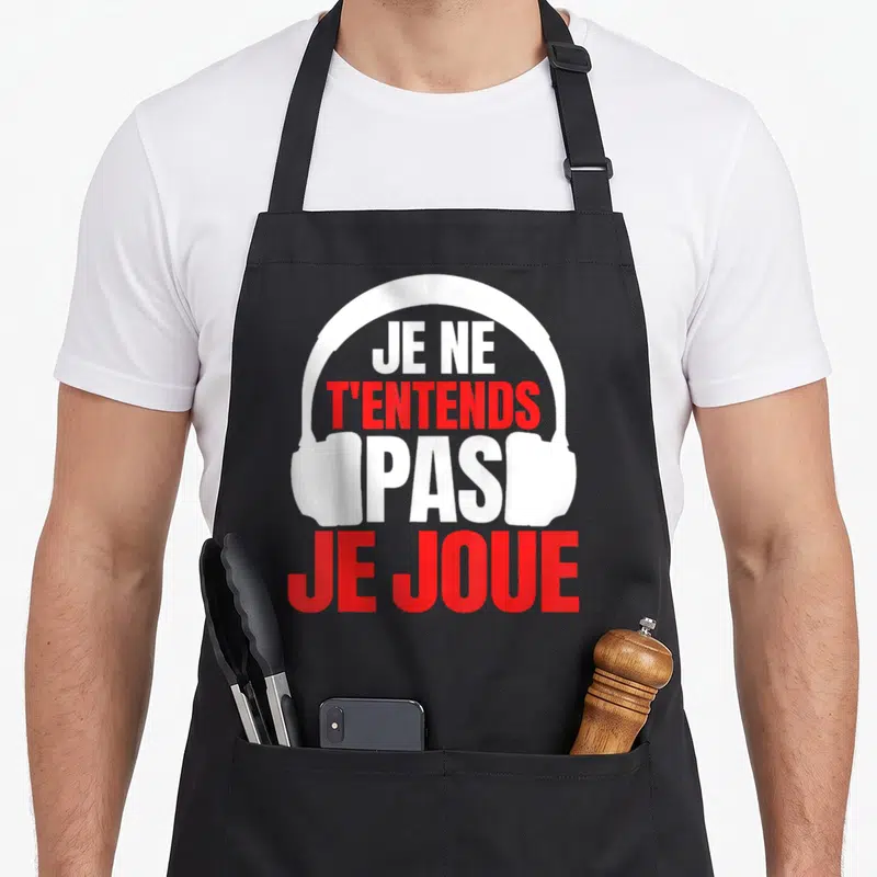 Tablier de cuisine noir avec l'illustration d'un casque audio blanc et du texte en rouge et blanc.