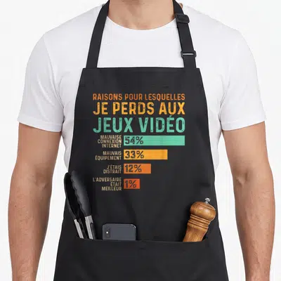Tablier de cuisine noir avec graphique coloré listant les raisons pour lesquelles je perds aux jeux vidéo en chiffres.