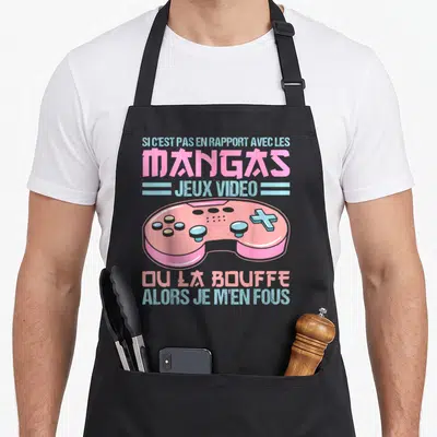 Tablier de cuisine noir avec une manette rose et le texte sur les mangas jeux vidéo ou la bouffe.
