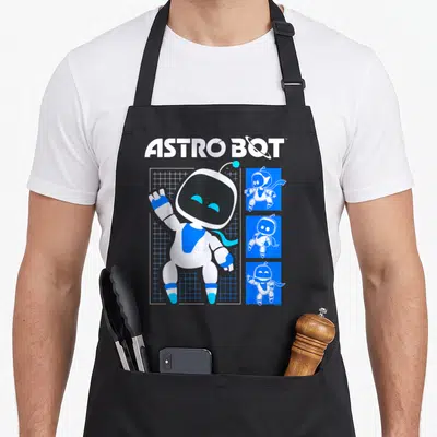 Tablier de cuisine noir avec illustration Astro Bot blanc et bleu sur fond quadrillé et trois petites versions du robot.