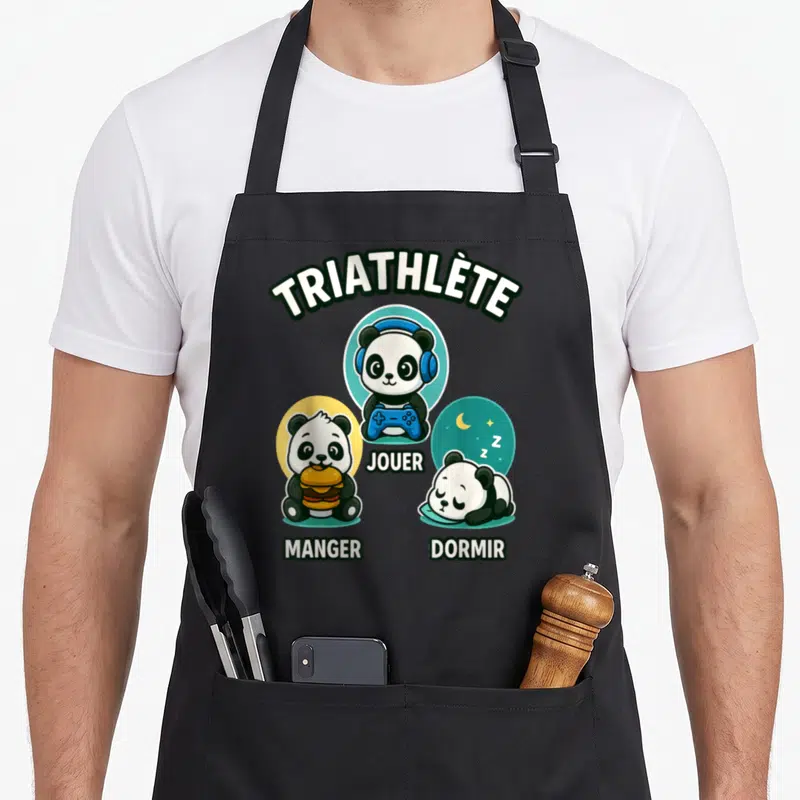 Tablier de cuisine noir avec un panda triathlète gamer mangeant, jouant et dormant.