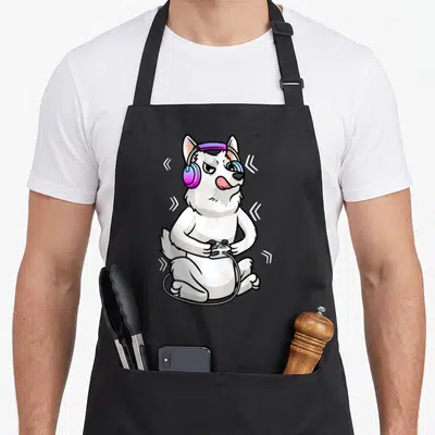 Tablier de cuisine noir avec illustration d'un Berger Blanc Suisse gamer aux écouteurs roses et manette noire.