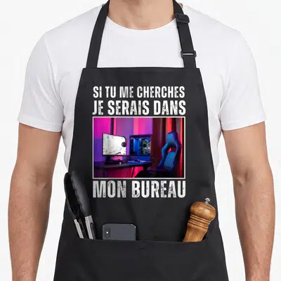 Tablier de cuisine noir avec inscription Si tu me cherches je serais dans mon bureau et photo d'une station gaming.