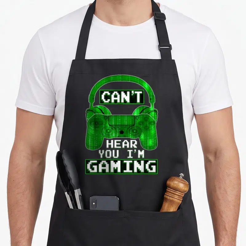 Tablier de cuisine noir avec manette et casque vert numérique Can't Hear You I'm Gaming