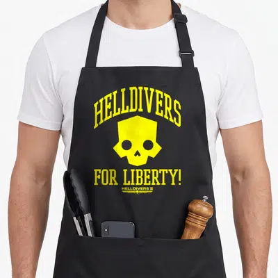 Tablier de cuisine noir avec logo crâne jaune et texte Helldivers For Liberty.