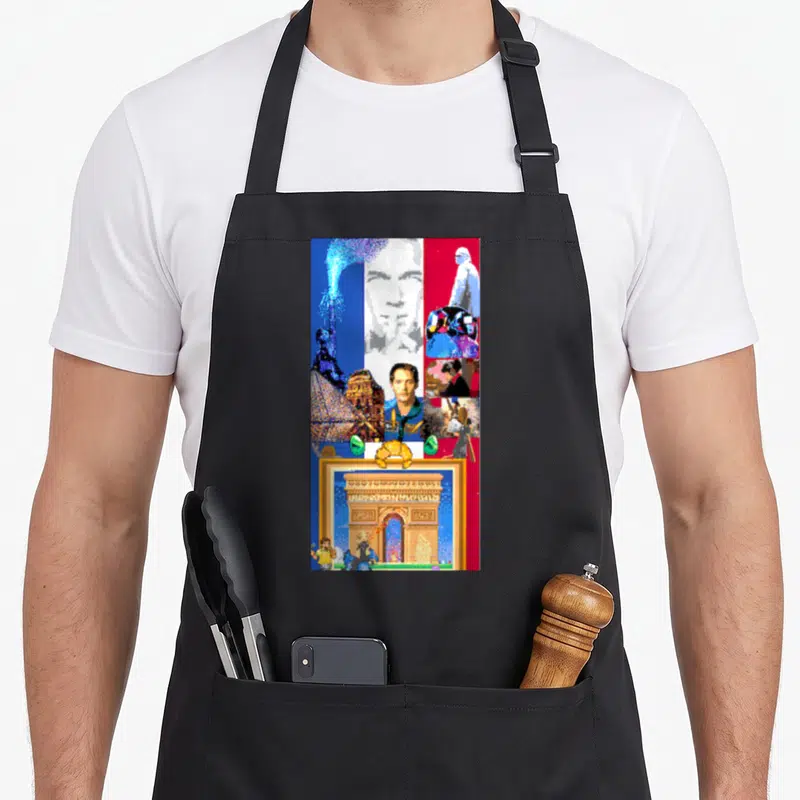 Tablier de cuisine noir avec un collage pixelisé représentant des monuments français, un croissant et des personnages de jeu vidéo.