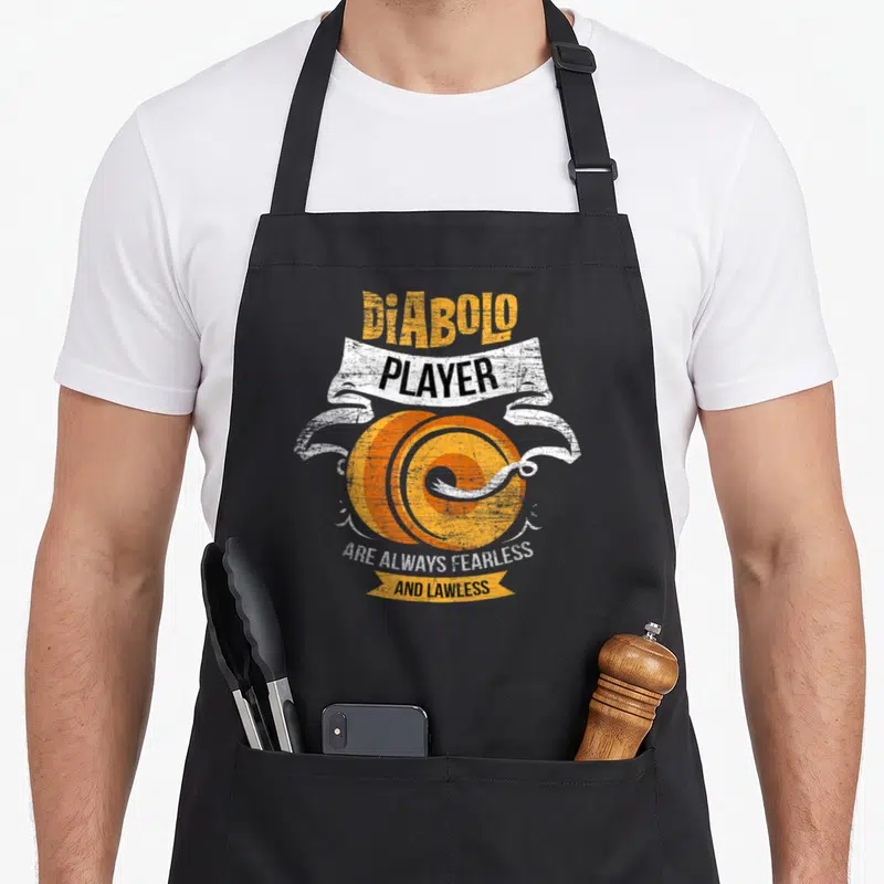 Tablier de cuisine noir avec illustration orange et blanche d'un diabolo et le texte Diabolo Player Are Always Fearless And Lawless.