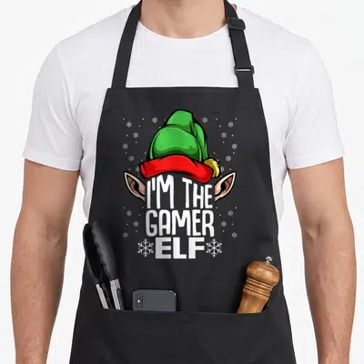 Tablier de cuisine noir avec illustration d'un elfe gamer au bonnet vert et texte blanc I'm the Gamer Elf.