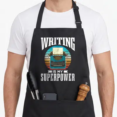 Tablier de cuisine noir avec une machine à écrire vintage et le texte L'écriture Est Mon Super Pouvoir Auteur Écrire À Écrivain.