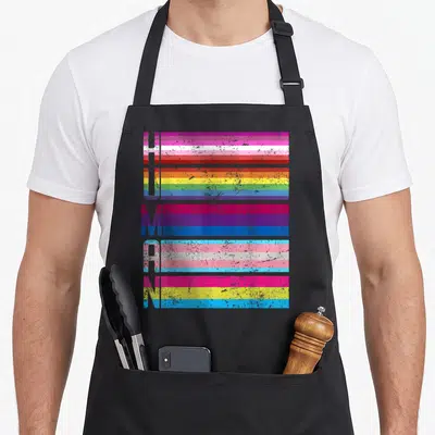 Tablier de cuisine noir avec le mot humain stylisé par des bandes colorées de drapeaux diversifiés.