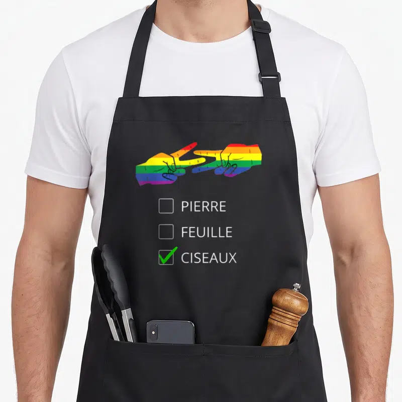 Tablier de cuisine noir orné de deux mains rainbow faisant des ciseaux et d'une liste à puces où ciseaux est validé.