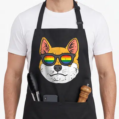 Tablier de cuisine noir avec tête de chien Shiba Inu aux verres de lunettes colorés en drapeau gay.