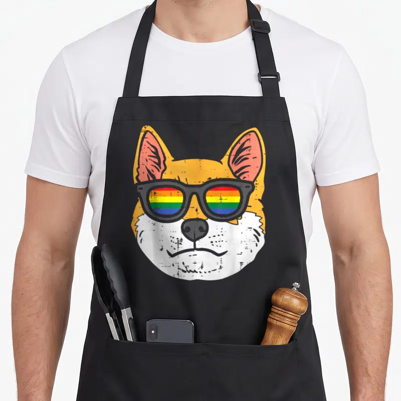 Tablier de cuisine noir avec tête de chien Shiba Inu aux verres de lunettes colorés en drapeau gay.