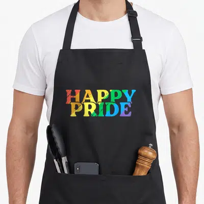Tablier de cuisine noir avec l'inscription Happy Pride aux couleurs de l'arc-en-ciel et effet texturé.