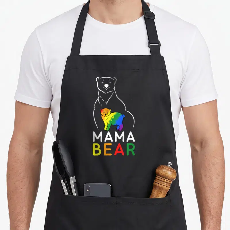 Tablier de cuisine noir avec illustration oursonne rainbow et texte Mama Bear Equal Rights en lettres colorées.