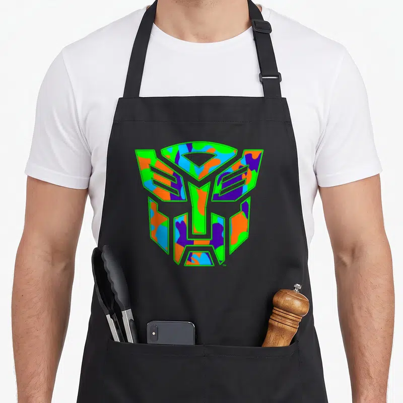 Tablier de cuisine noir avec le logo Autobot rempli d'un motif Neonn Camo multicolore.