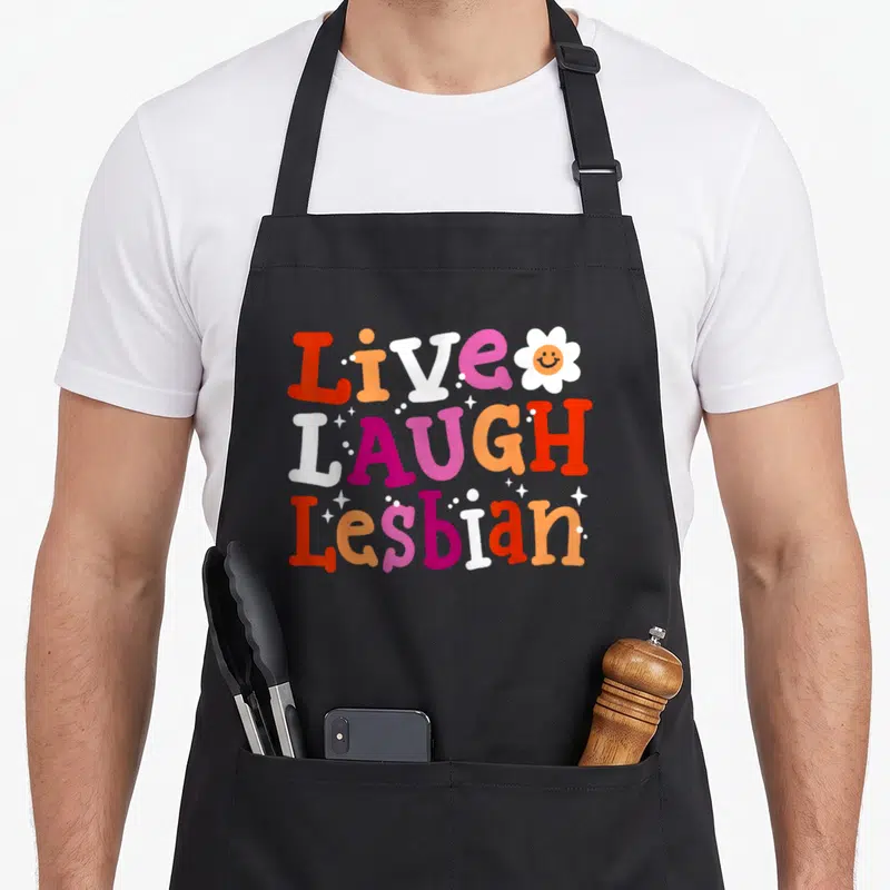 Tablier de cuisine noir avec typographie colorée Live Laugh Lesbian et fleur souriante retro