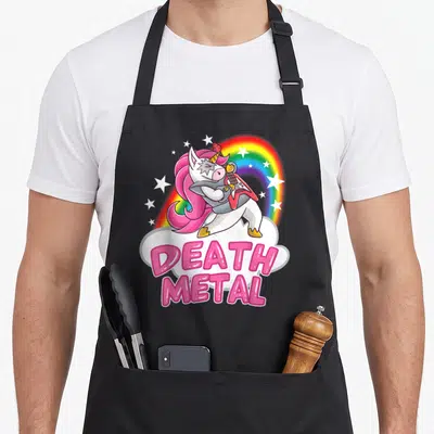 Tablier de cuisine noir avec une licorne jouant de la guitare sous un arc-en-ciel et le texte Death Metal en rose.