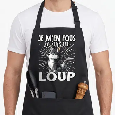 Tablier de cuisine noir avec illustration d'un sweet wolf et le texte Je m'en fous je suis un loup en lettres blanches.