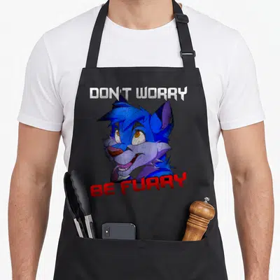 Tablier de cuisine noir avec un loup anthropomorphe bleu et violet aux yeux exagérés et une expression comique.