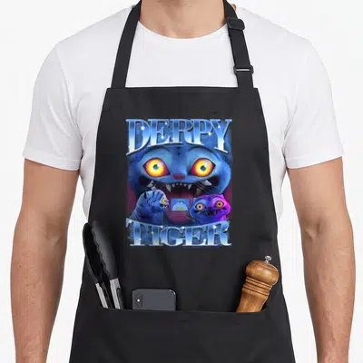 Tablier de cuisine noir avec un tigre bleu aux yeux jaunes et le texte Derpy Tiger en lettres scintillantes.