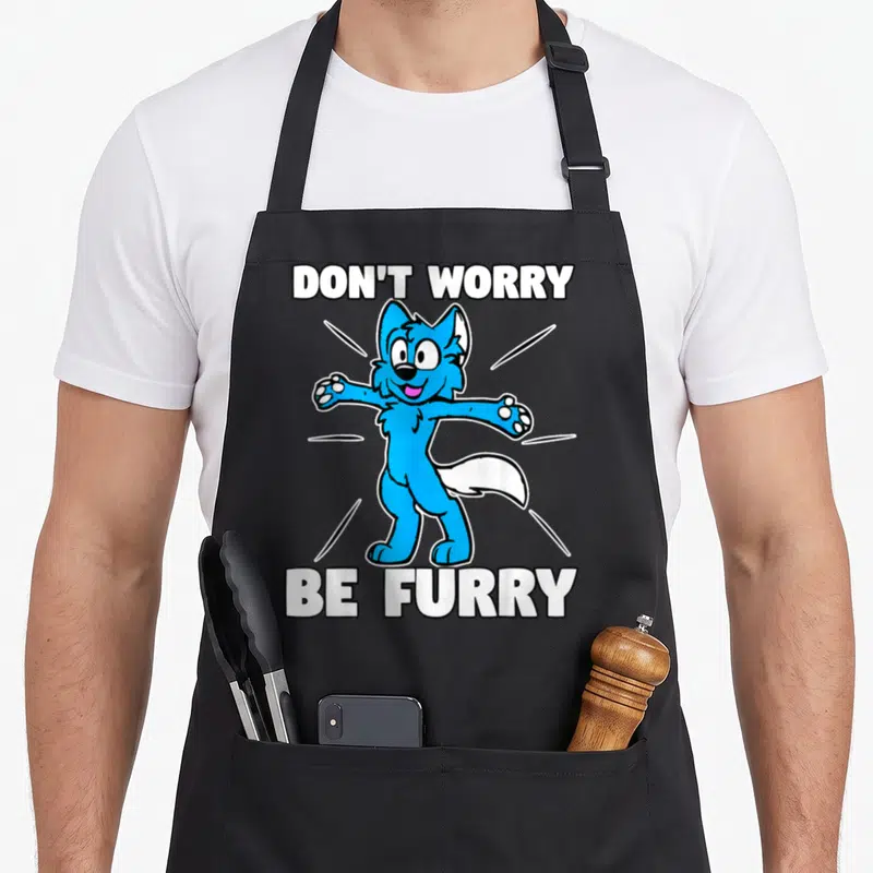 Tablier de cuisine noir avec un renard bleu souriant aux bras ouverts et l'inscription Don't Worry Be Furry en lettres blanches.