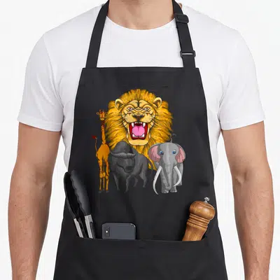 Tablier de cuisine noir avec illustration colorée d'un lion, girafe, buffle et éléphant sur fond uni.