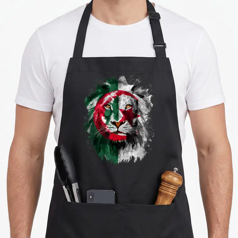 Tablier de cuisine noir avec tête de lion aux couleurs du drapeau Algérie en style peinture vintage.