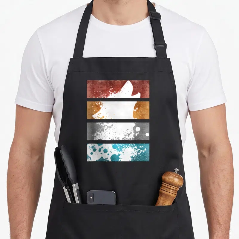 Tablier de cuisine noir avec silhouette de loup blanc sur bandes rouges, oranges, grises et bleues texturées
