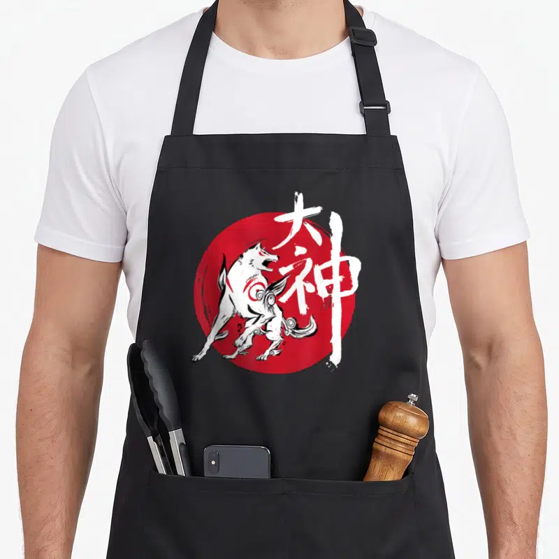 Tablier de cuisine noir avec illustration loup blanc Amaterasu sur cercle rouge et caractères japonais.
